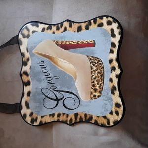 Cute high heel shoe wall hanging that says "gorgeous" on it.